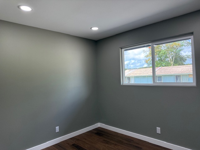 144 Chong Street Hilo, HI 96720 - Photo 17 of 28 a view of wooden floor and windows in a room