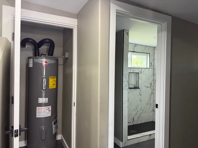 a bathroom with a bathtub and shower