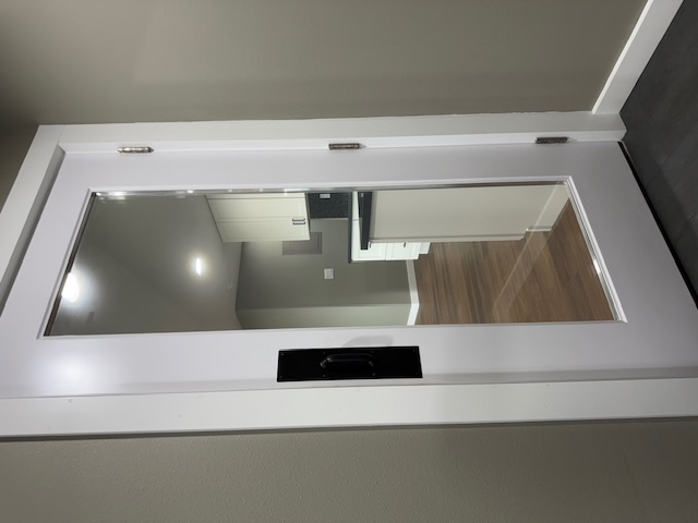 144 Chong Street Hilo, HI 96720 - Photo 22 of 28 a view of a hallway with wooden floor