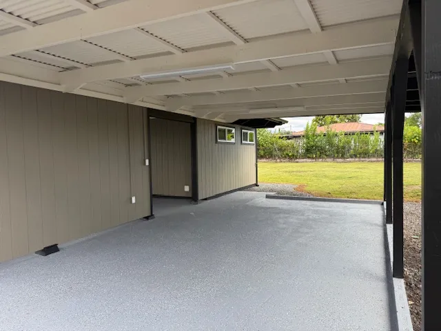 a backyard of a house with table and chairs