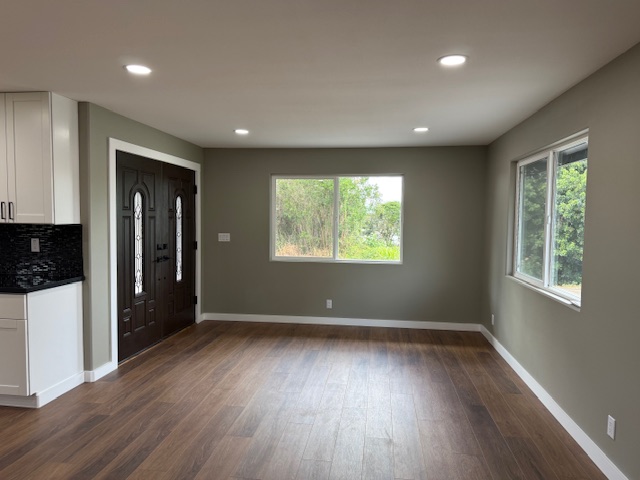 144 Chong Street Hilo, HI 96720 - Photo 5 of 28 a view of an empty room with wooden floor and a window