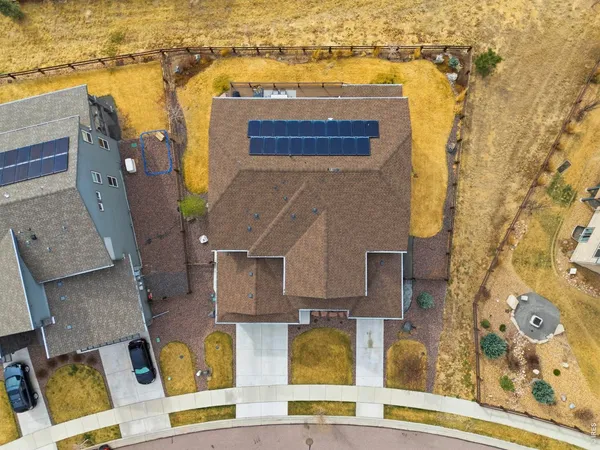 an aerial view of residential houses with outdoor space