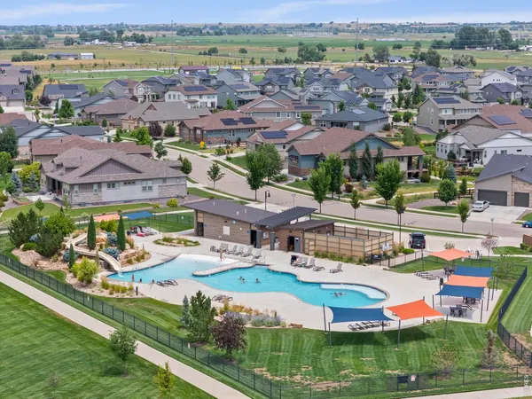 an aerial view of residential houses and outdoor space