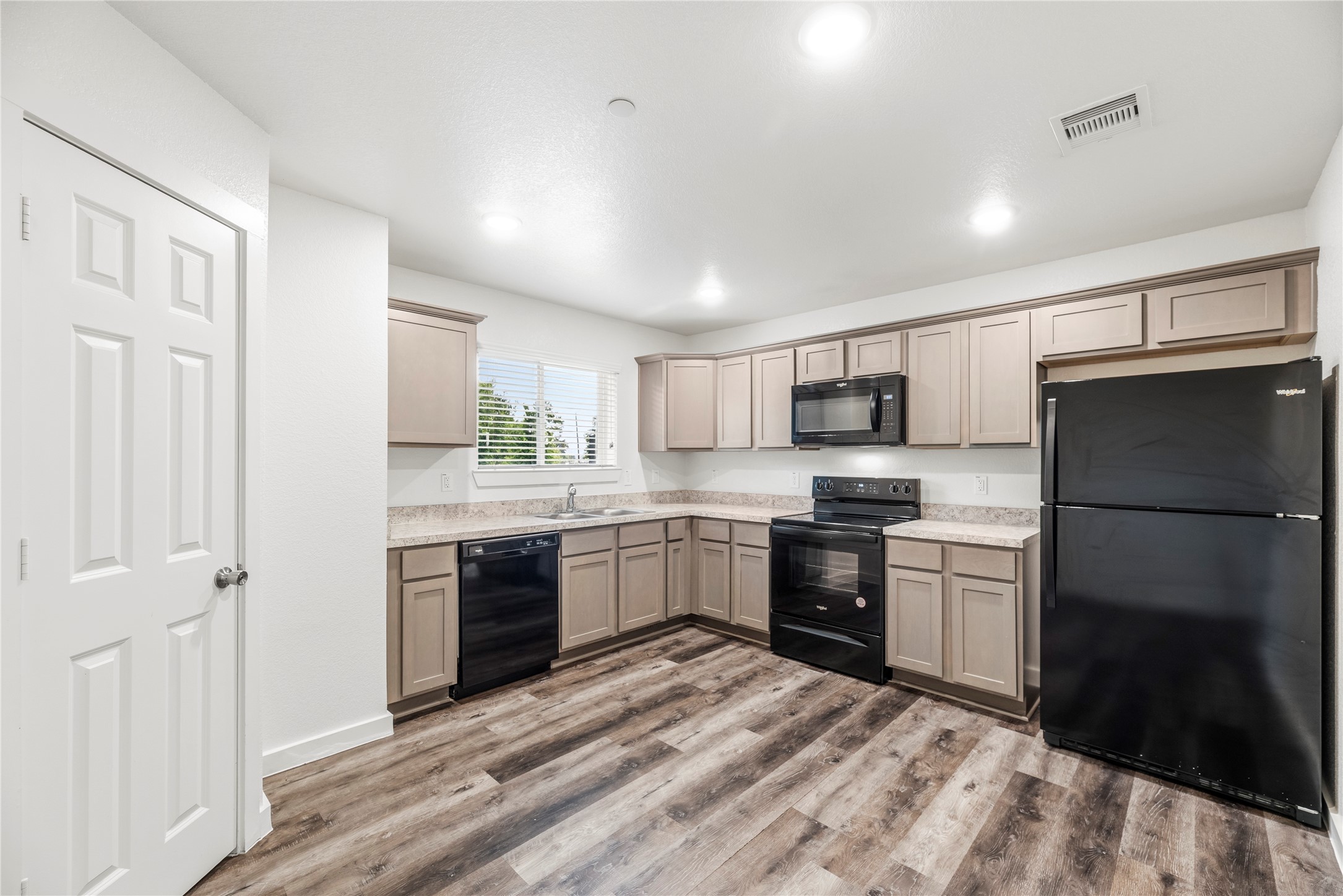 12603 Telge Road, Unit 1EH Cypress, TX 77429 - Photo 5 of 19 Lovely kitchen with black appliances.