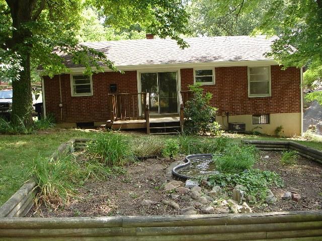 4429 Glenn Ridge Road Northwest Roanoke, VA 24017 - Photo 2 of 7 a front view of a house with garden