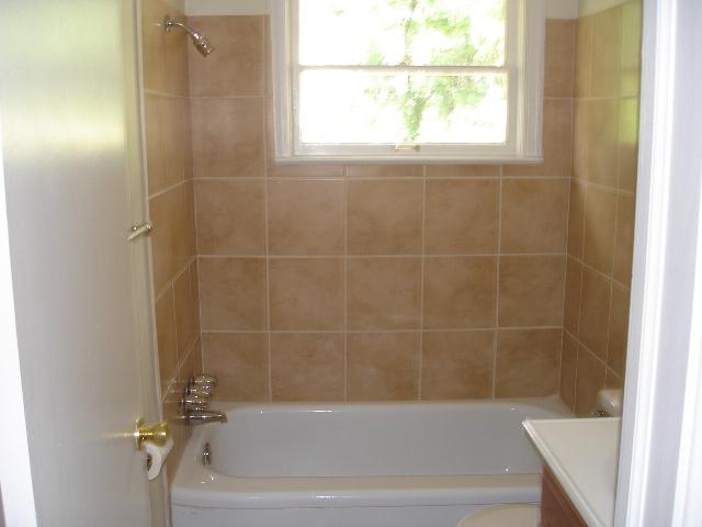 4429 Glenn Ridge Road Northwest Roanoke, VA 24017 - Photo 3 of 7 a bathroom with a bathtub and window