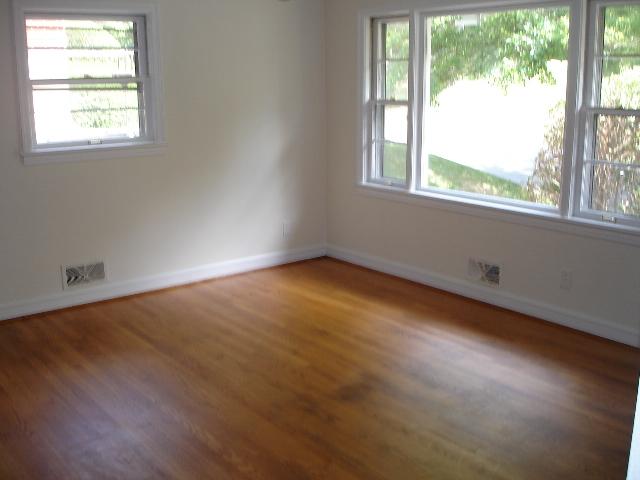 4429 Glenn Ridge Road Northwest Roanoke, VA 24017 - Photo 6 of 7 an empty room with wooden floor and windows