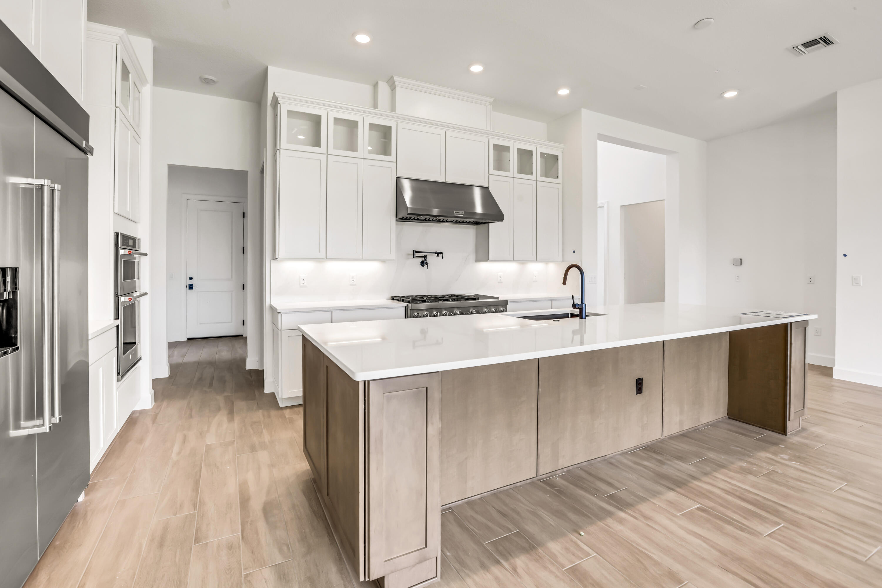 20161 Southeast Bridgewater Drive Jupiter, FL 33458 - Photo 15 of 50 a kitchen with stainless steel appliances sink refrigerator and microwave