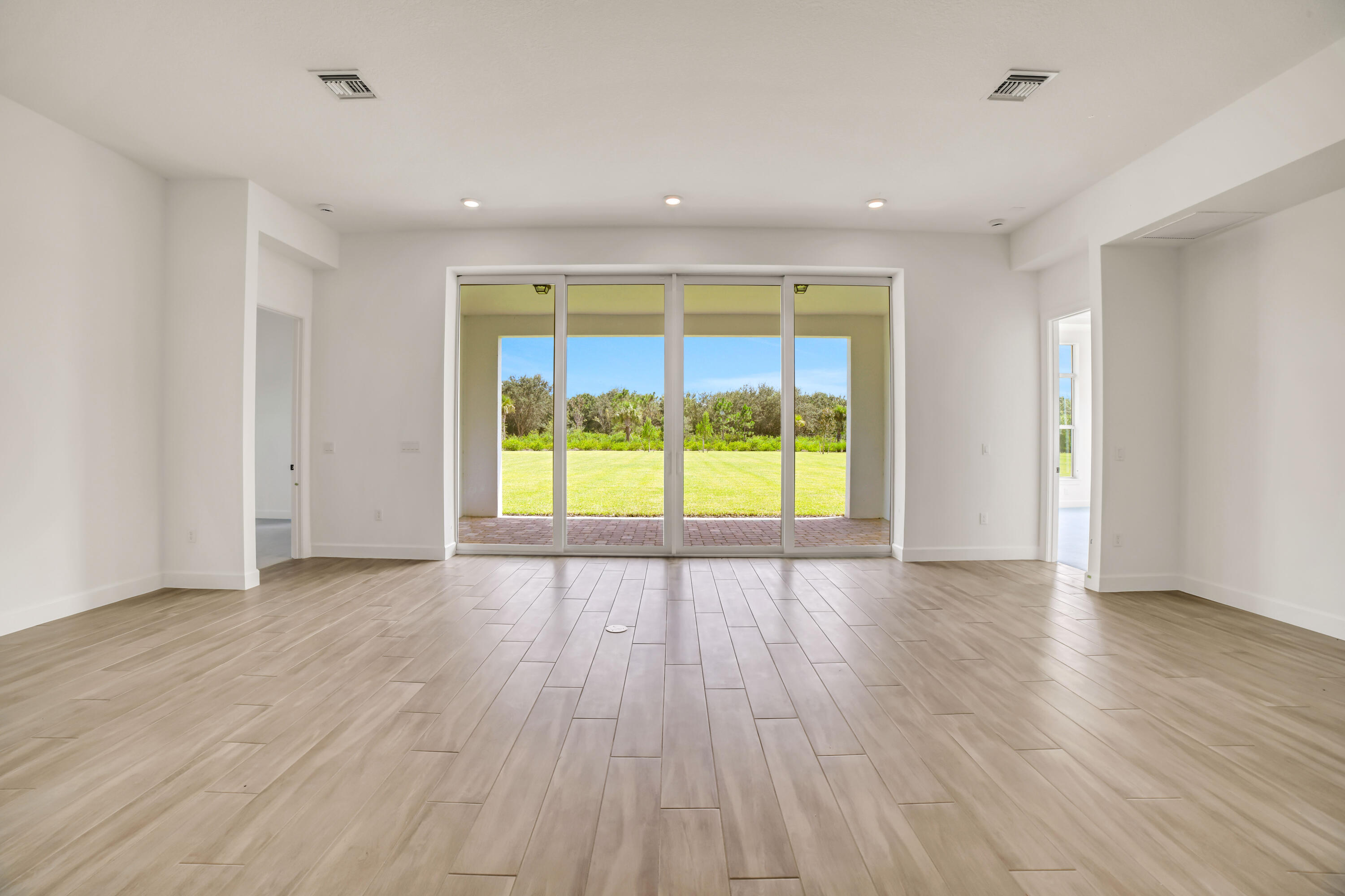 20161 Southeast Bridgewater Drive Jupiter, FL 33458 - Photo 17 of 50 wooden floor in an empty room with a window