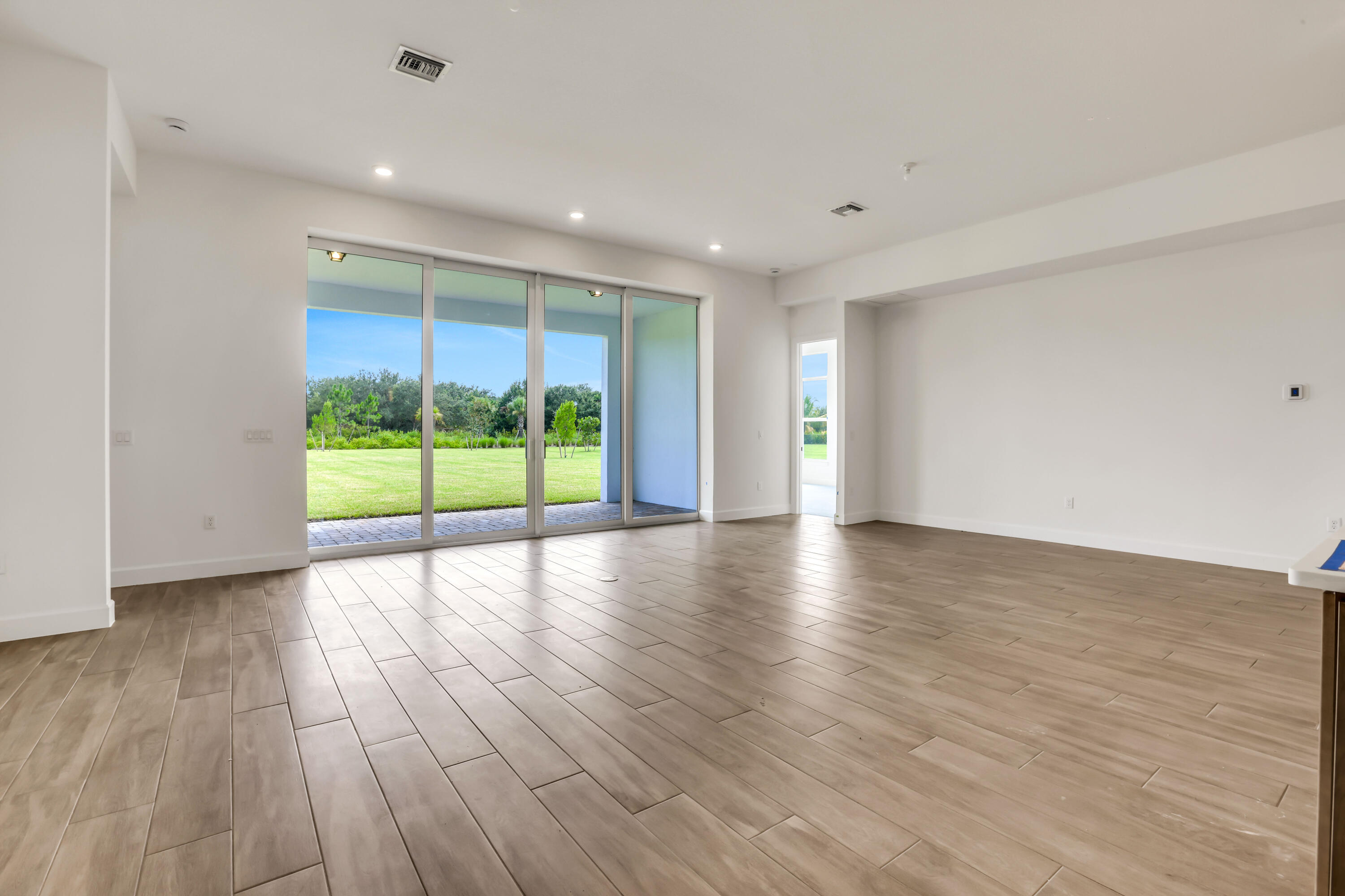 20161 Southeast Bridgewater Drive Jupiter, FL 33458 - Photo 18 of 50 a view of room with wooden floor and window