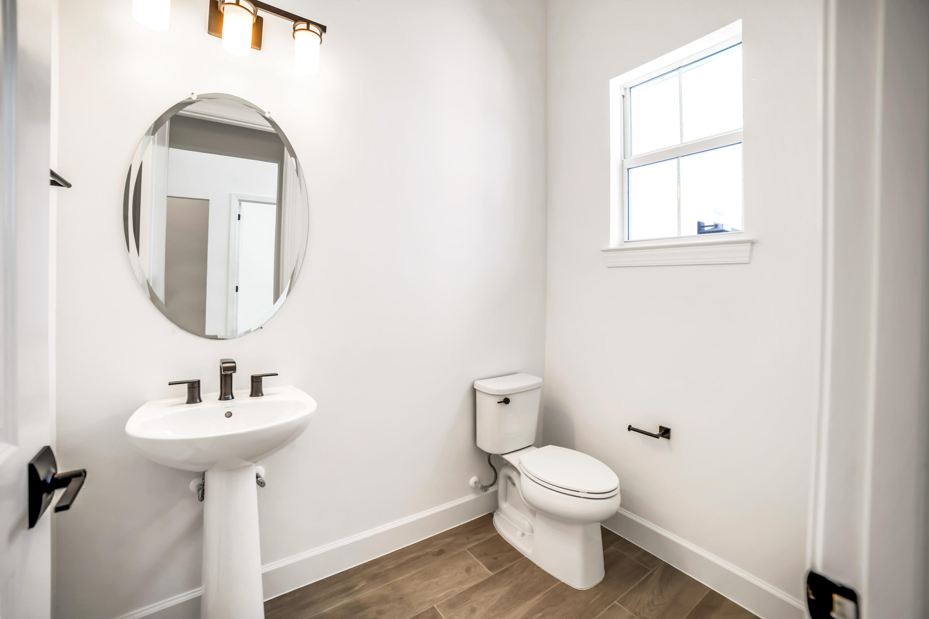 20161 Southeast Bridgewater Drive Jupiter, FL 33458 - Photo 19 of 50 a bathroom with a toilet sink and mirror