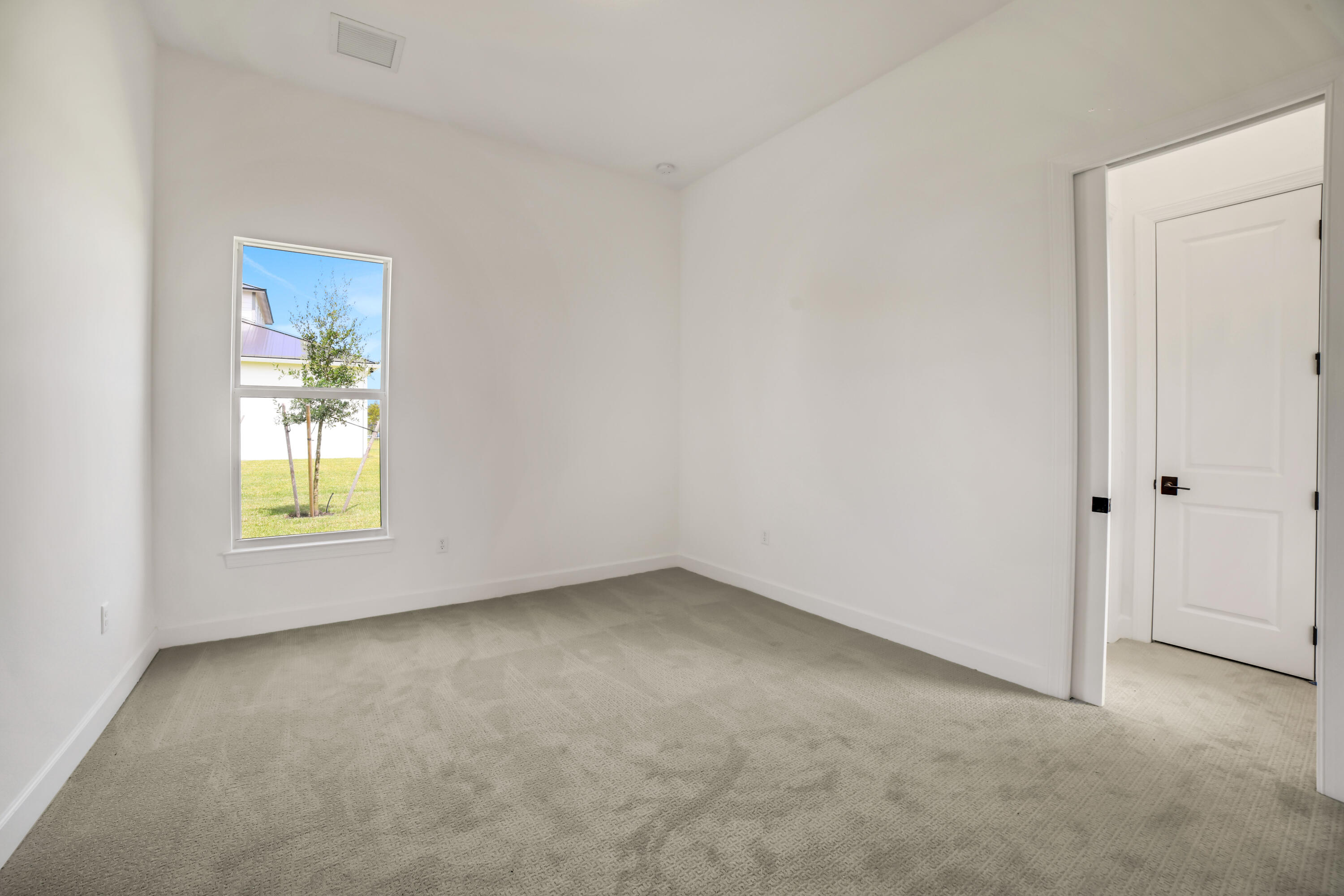 20161 Southeast Bridgewater Drive Jupiter, FL 33458 - Photo 32 of 50 an empty room with a window
