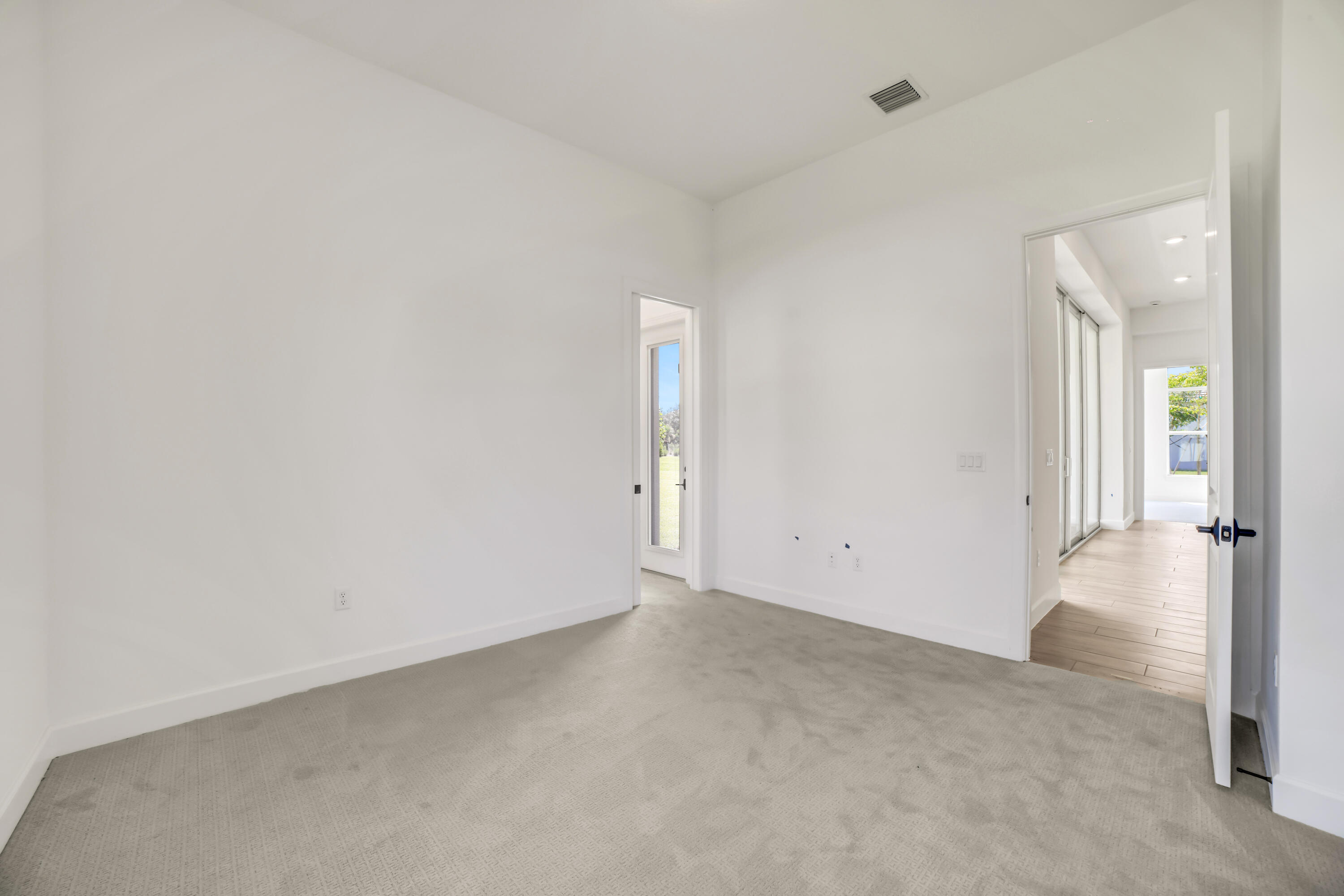 20161 Southeast Bridgewater Drive Jupiter, FL 33458 - Photo 34 of 50 an empty room with closet and wooden floor