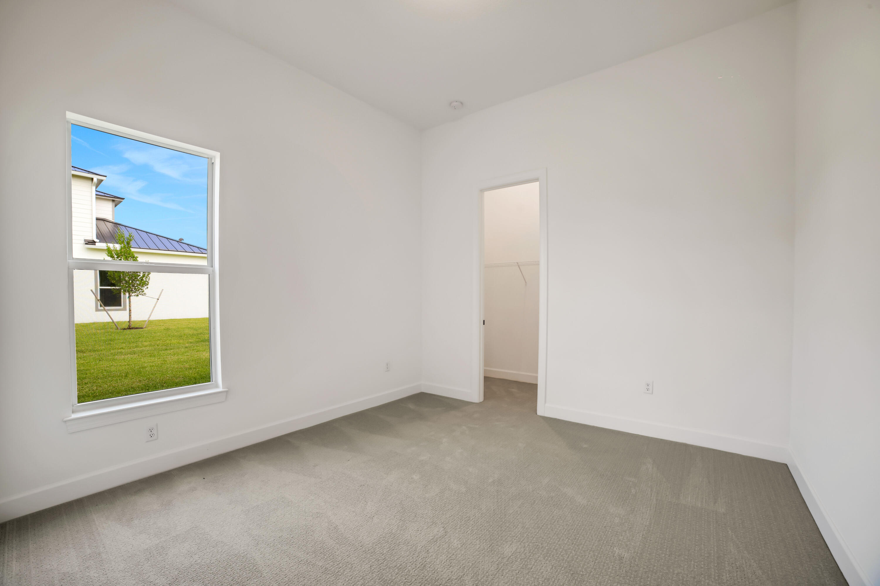 20161 Southeast Bridgewater Drive Jupiter, FL 33458 - Photo 47 of 50 a view of an empty room with a window