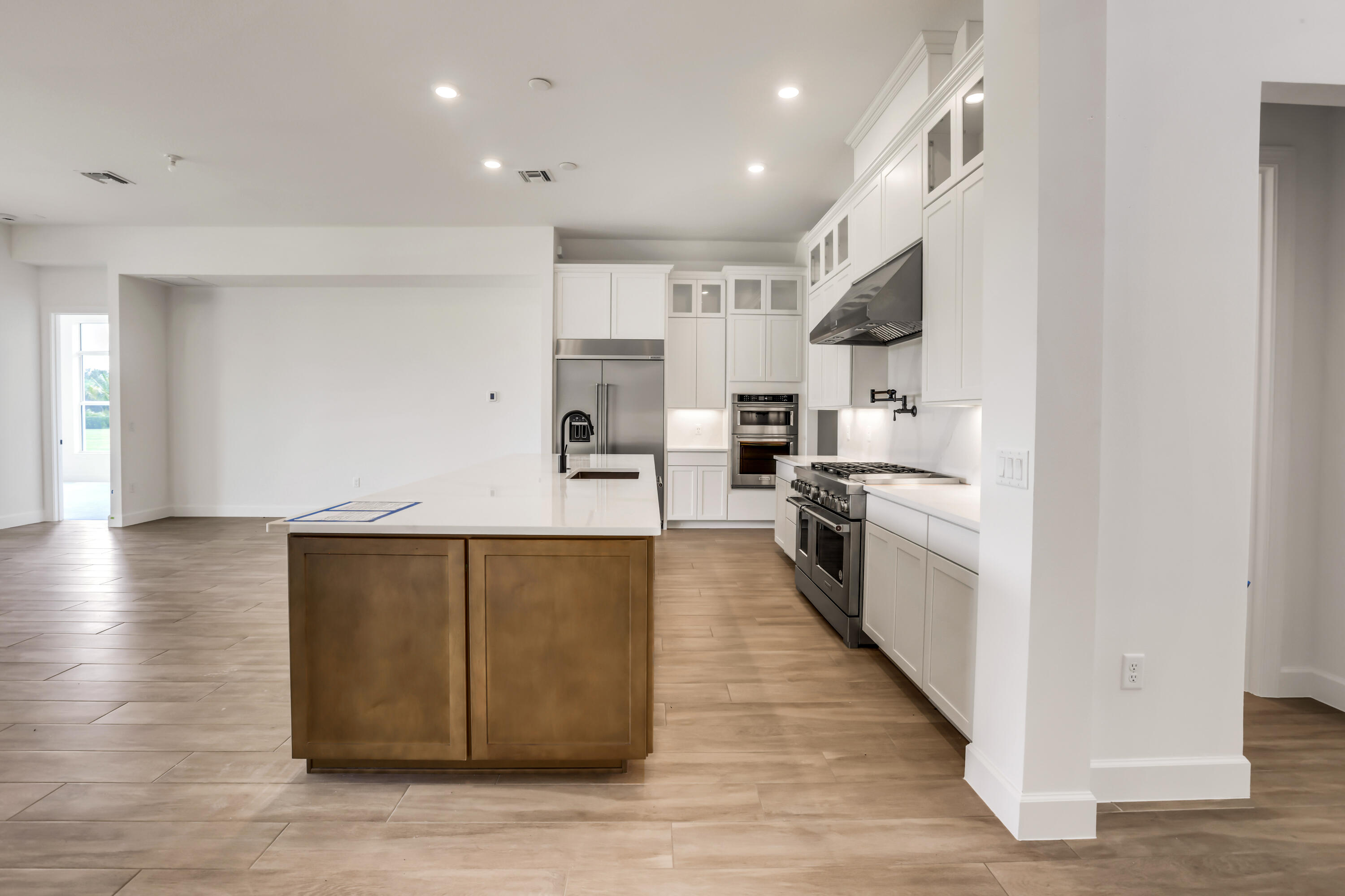 20161 Southeast Bridgewater Drive Jupiter, FL 33458 - Photo 6 of 50 a large kitchen with stainless steel appliances granite countertop a large counter top and a stove