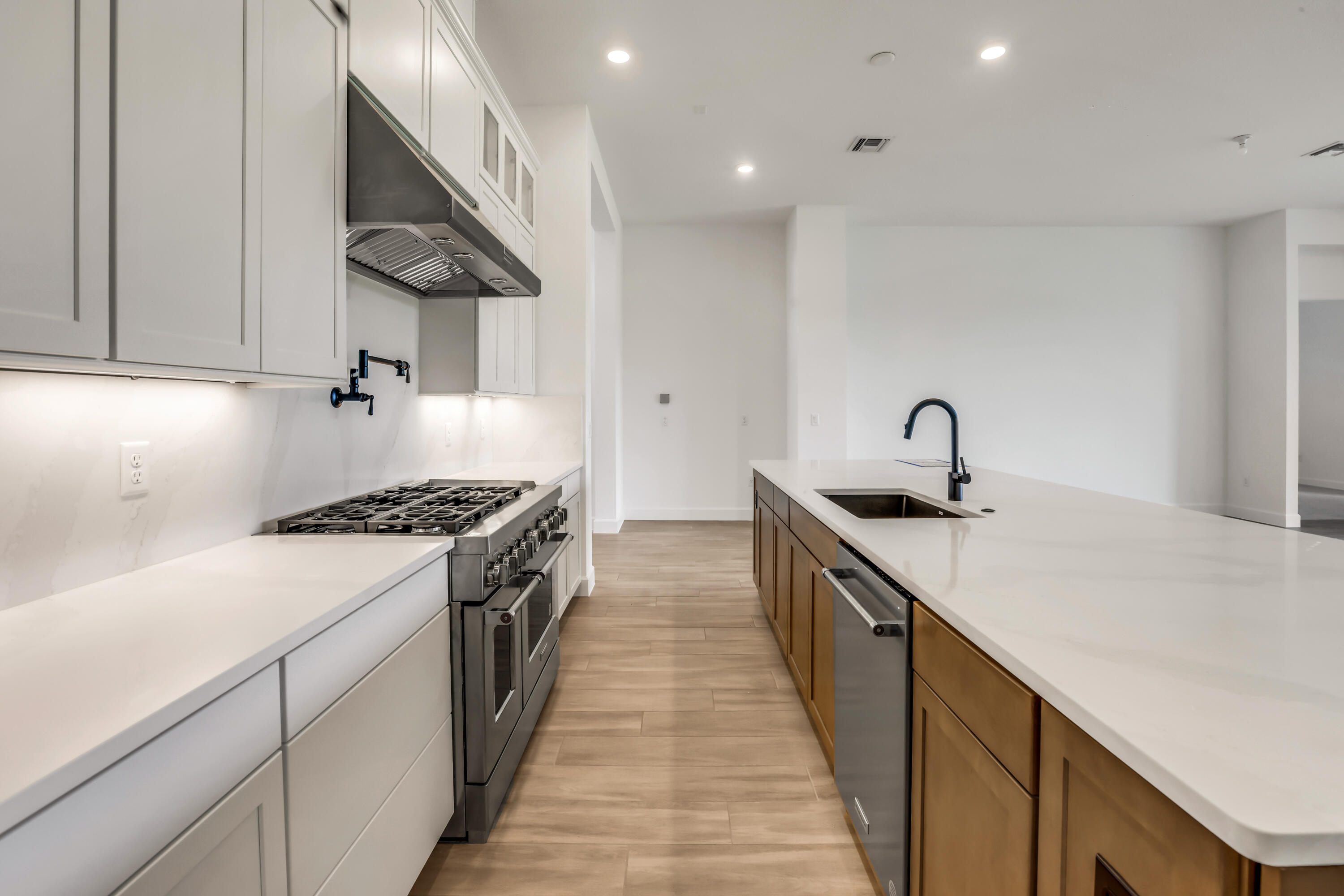 20161 Southeast Bridgewater Drive Jupiter, FL 33458 - Photo 8 of 50 a kitchen with a stove and a sink
