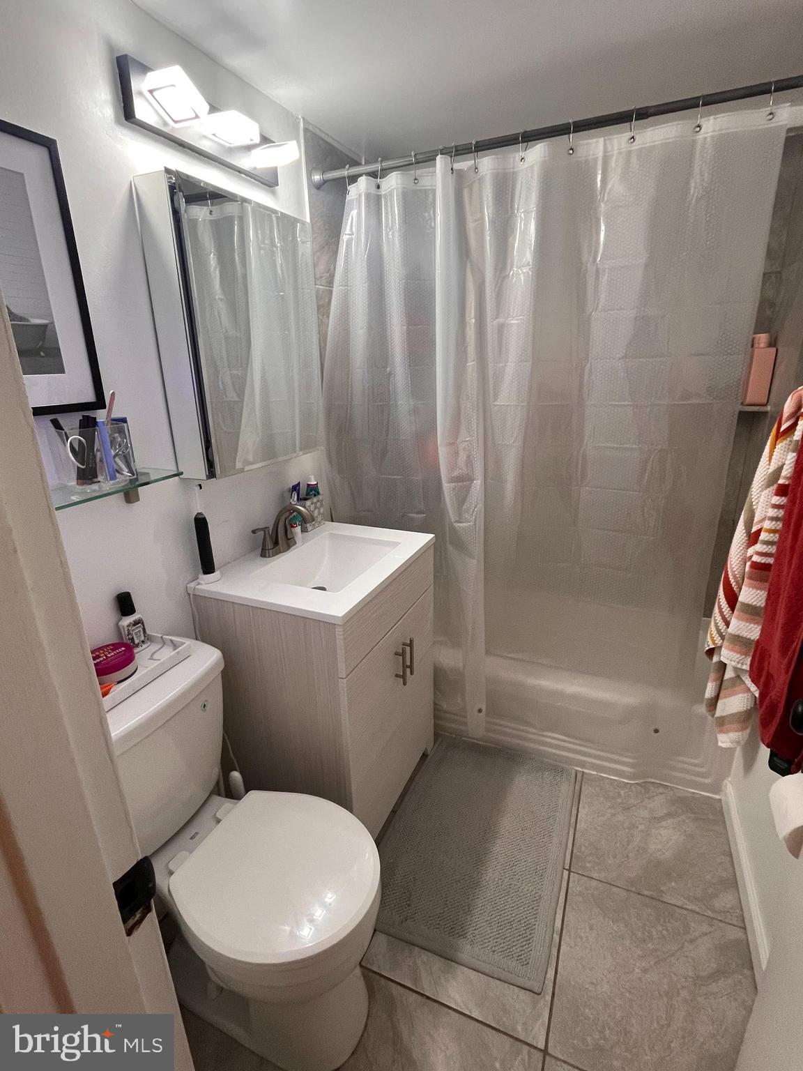 2101-17 Chestnut Street, Unit 319 Philadelphia, PA 19103 - Photo 27 of 33 a bathroom with a sink toilet and shower