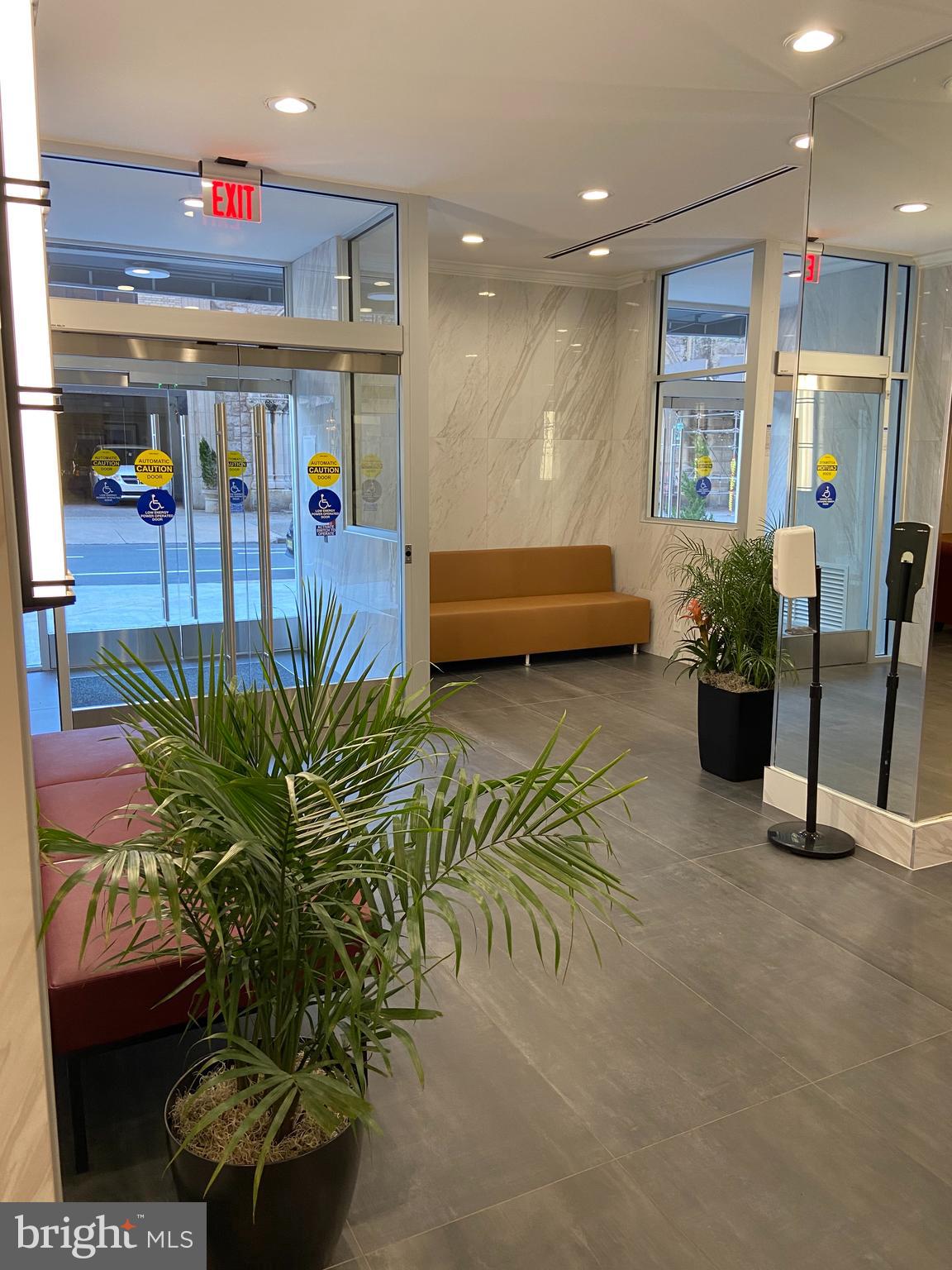 2101-17 Chestnut Street, Unit 319 Philadelphia, PA 19103 - Photo 33 of 33 a lobby with furniture and potted plant