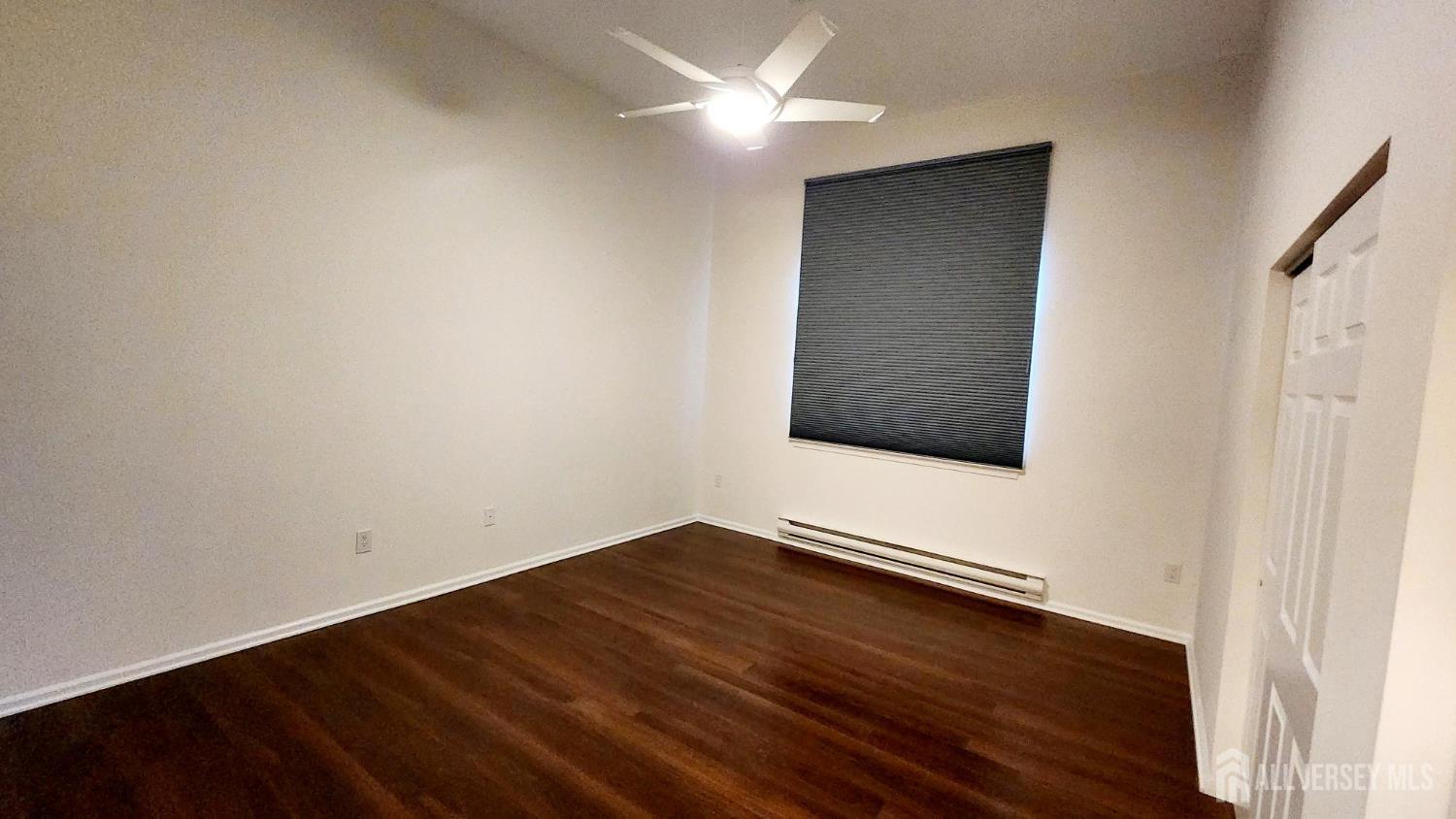 838 Vail Road, Unit A Monroe Township, NJ 08831 - Photo 13 of 34 a view of an empty room with wooden floor