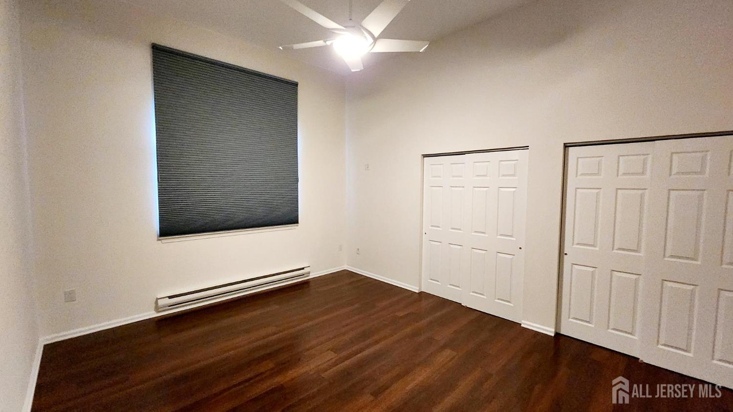 838 Vail Road, Unit A Monroe Township, NJ 08831 - Photo 14 of 34 a view of an empty room with wooden floor