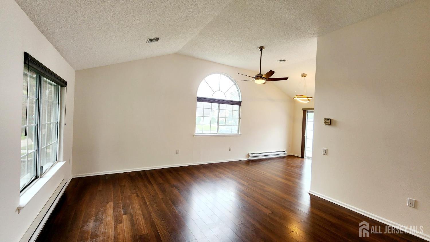 838 Vail Road, Unit A Monroe Township, NJ 08831 - Photo 2 of 34 wooden floor in an empty room with a window