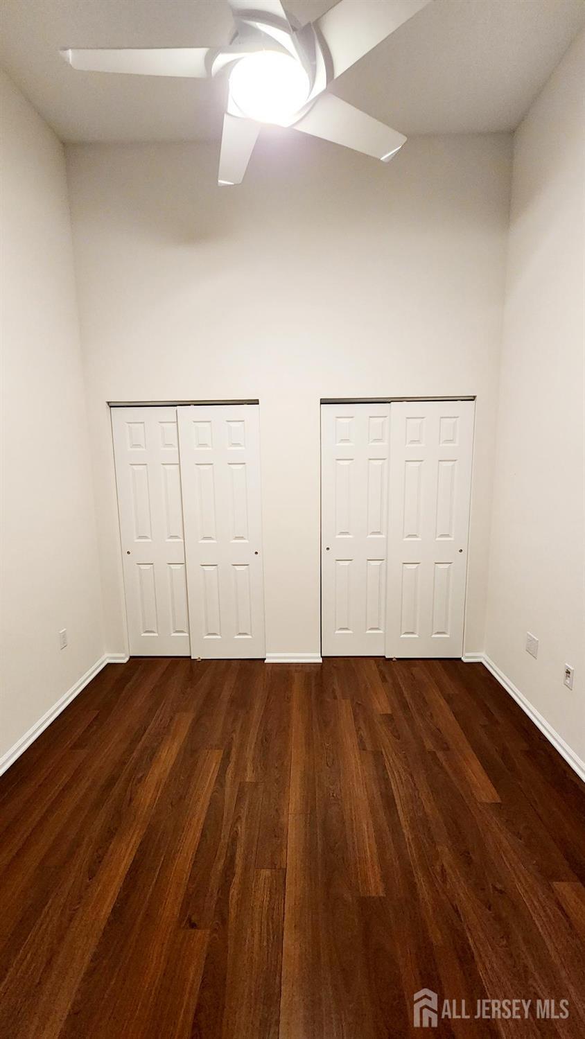 838 Vail Road, Unit A Monroe Township, NJ 08831 - Photo 22 of 34 a view of an empty room with wooden floor