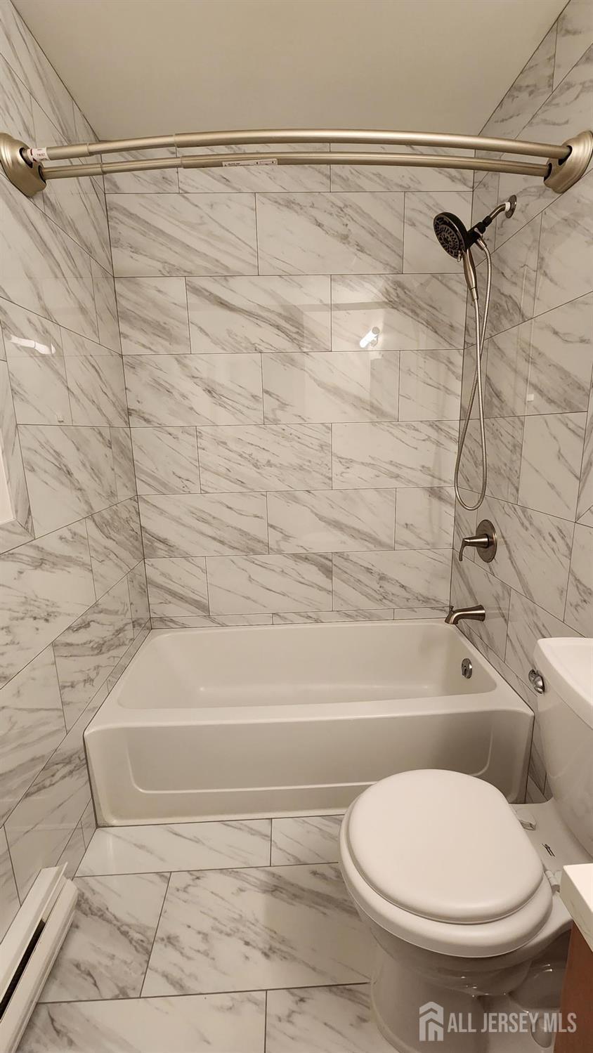 838 Vail Road, Unit A Monroe Township, NJ 08831 - Photo 26 of 34 a bathroom with a toilet and a bathtub