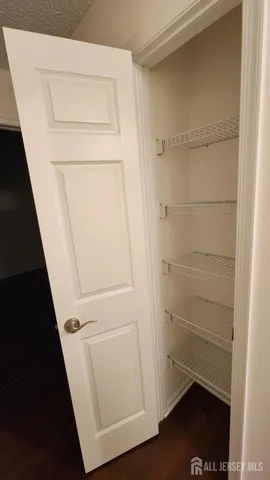 a view of storage and utility room with empty racks