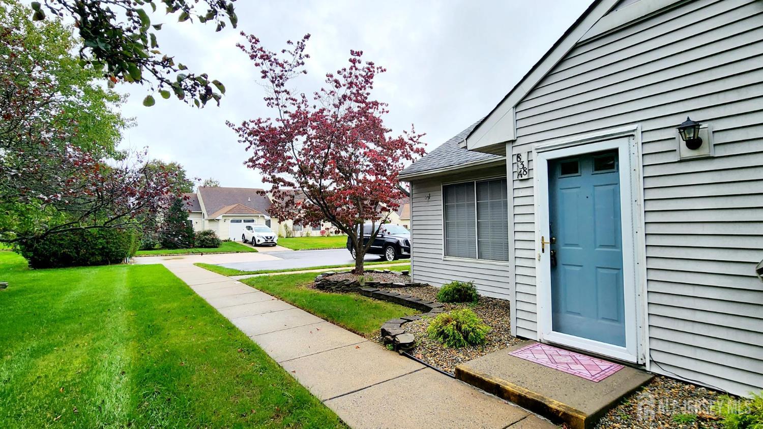 838 Vail Road, Unit A Monroe Township, NJ 08831 - Photo 33 of 34 a front view of a house with garden
