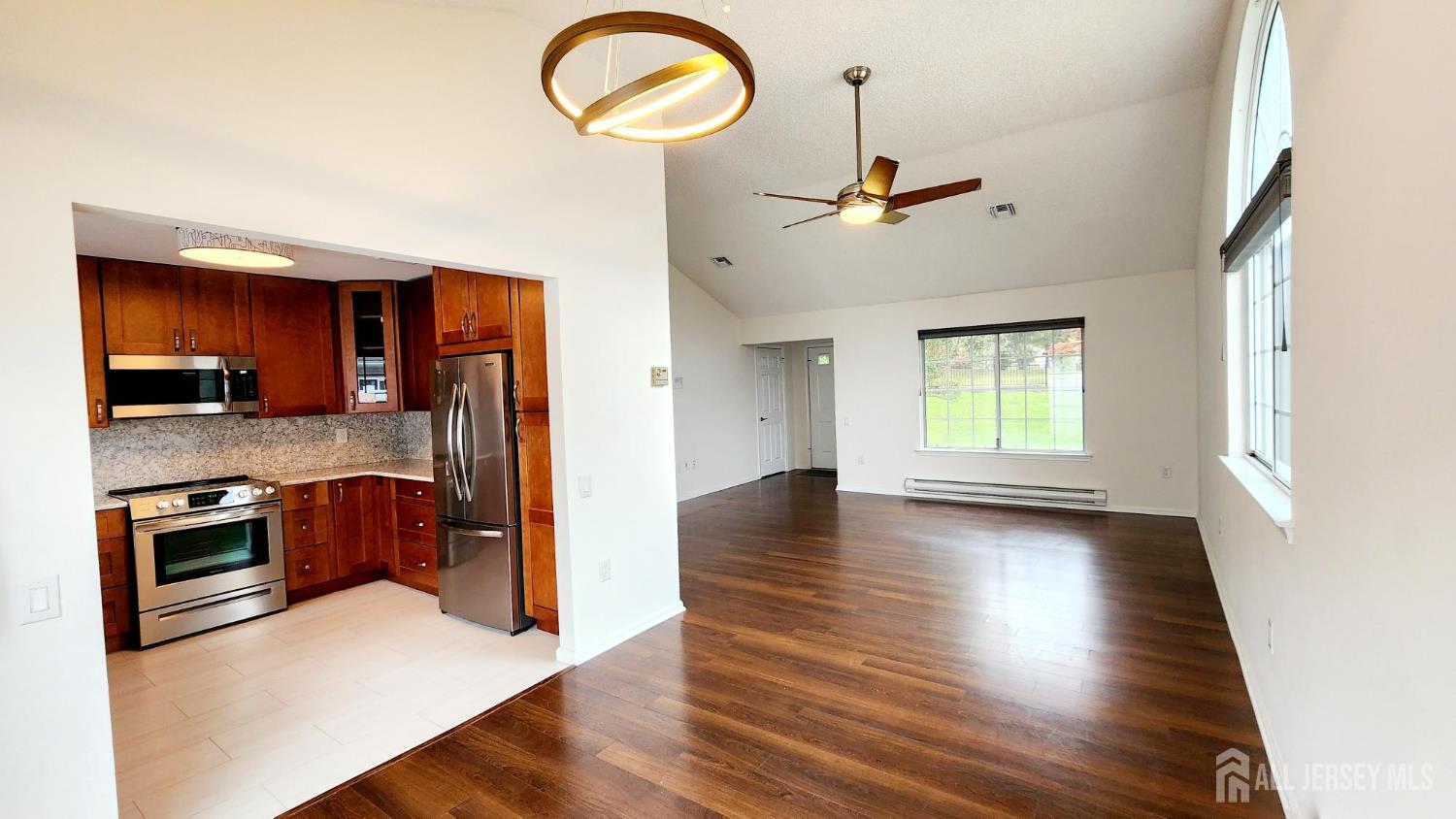 838 Vail Road, Unit A Monroe Township, NJ 08831 - Photo 5 of 34 a view of a kitchen from the hallway