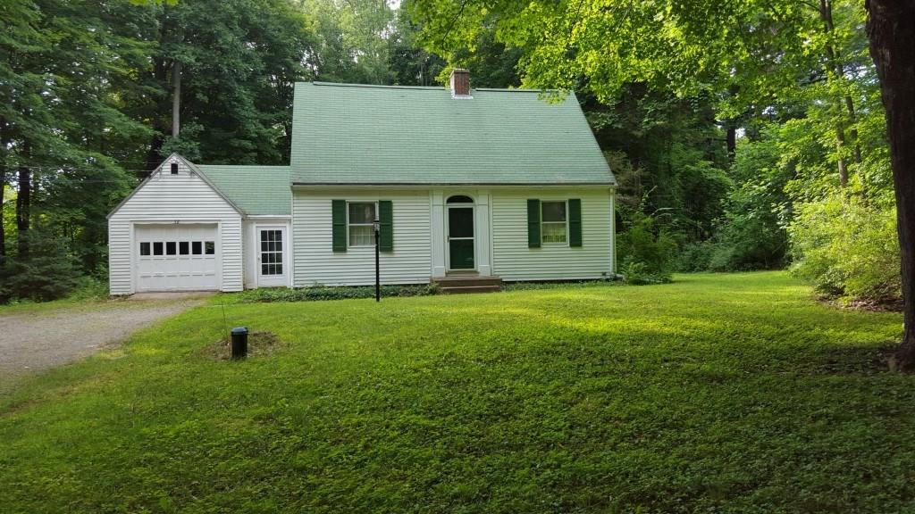 a house view with a garden space