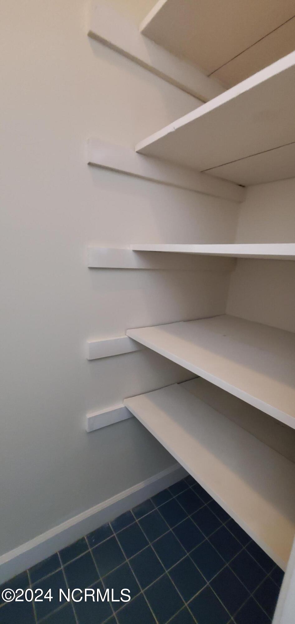 1827 Quail Ridge Road Greenville, NC 27858 - Photo 14 of 21 View of linen closet in primary bathroom.
