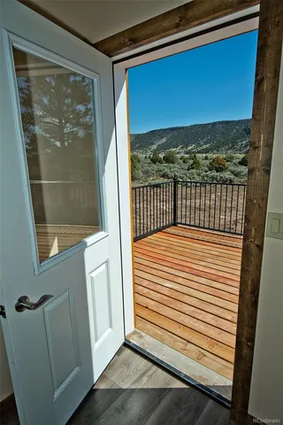 a view of a balcony with wooden floor