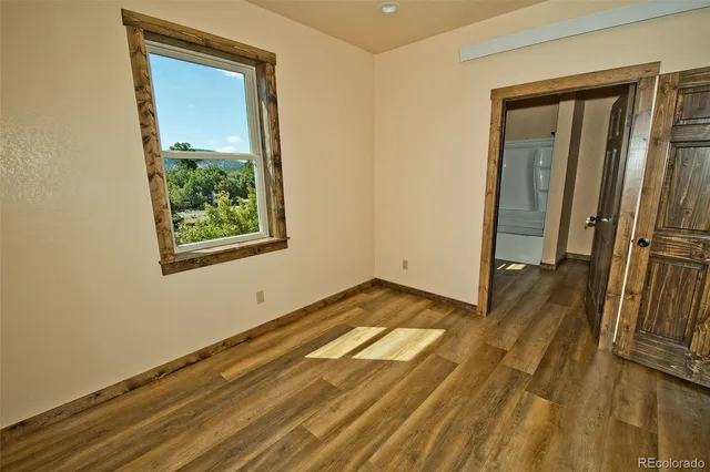 a bathroom with a granite countertop shower