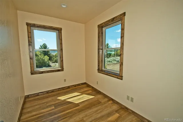 a view of room with window and ceiling fan
