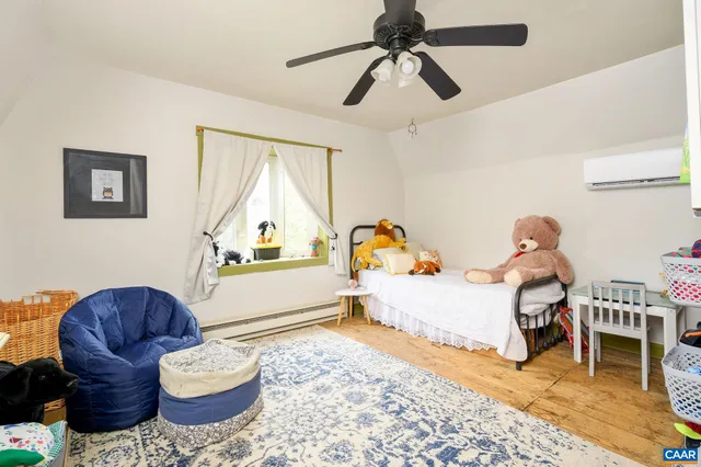 a living room with a couch and a chandelier