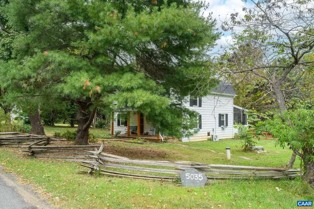 a view of a house with a big yard