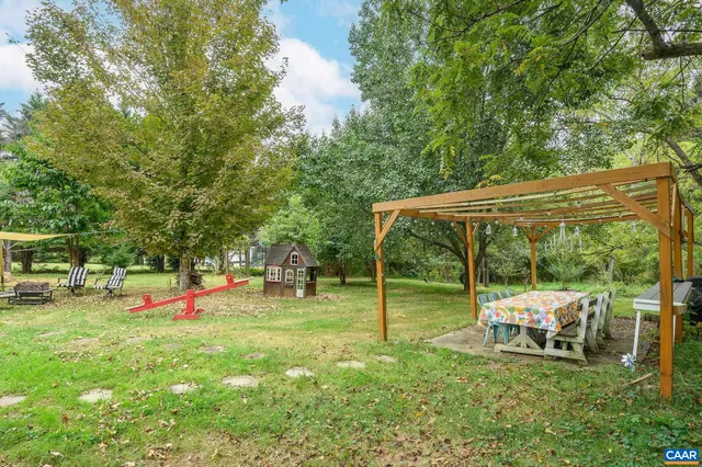 an outdoor sitting area with golf course