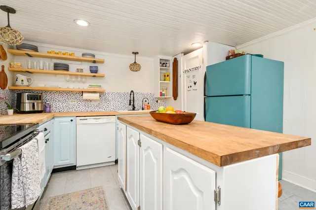 a kitchen with a sink and a refrigerator