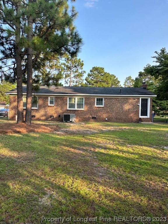 4553 Ruby Road Fayetteville, NC 28311 - Photo 17 of 19 a front view of a house with a yard table and chairs