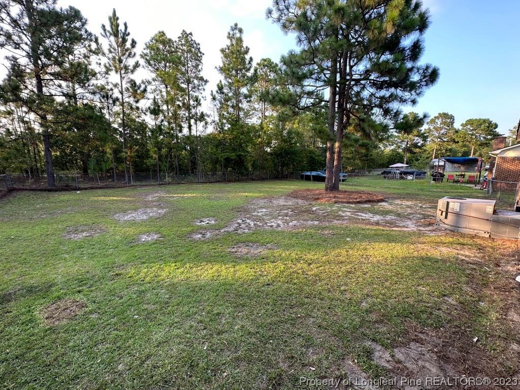4553 Ruby Road Fayetteville, NC 28311 - Photo 19 of 19 a view of a water fountain and a big yard