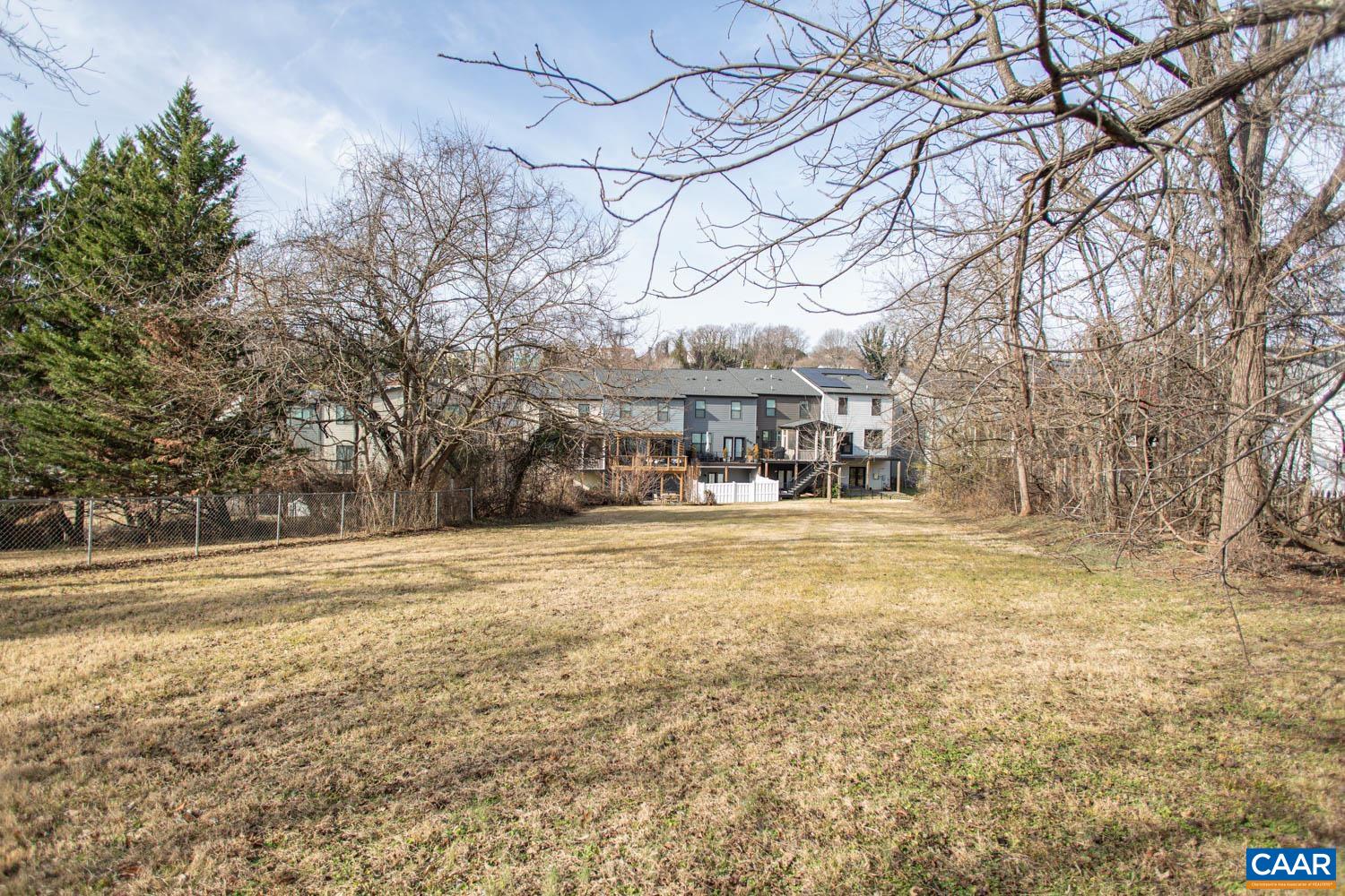 611 Rives Street Charlottesville, VA 22902 - Photo 7 of 18 a swimming pool with outdoor seating and yard