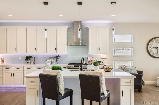 a kitchen with a sink cabinets and window