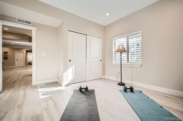 a spacious bedroom with a large bed and a window