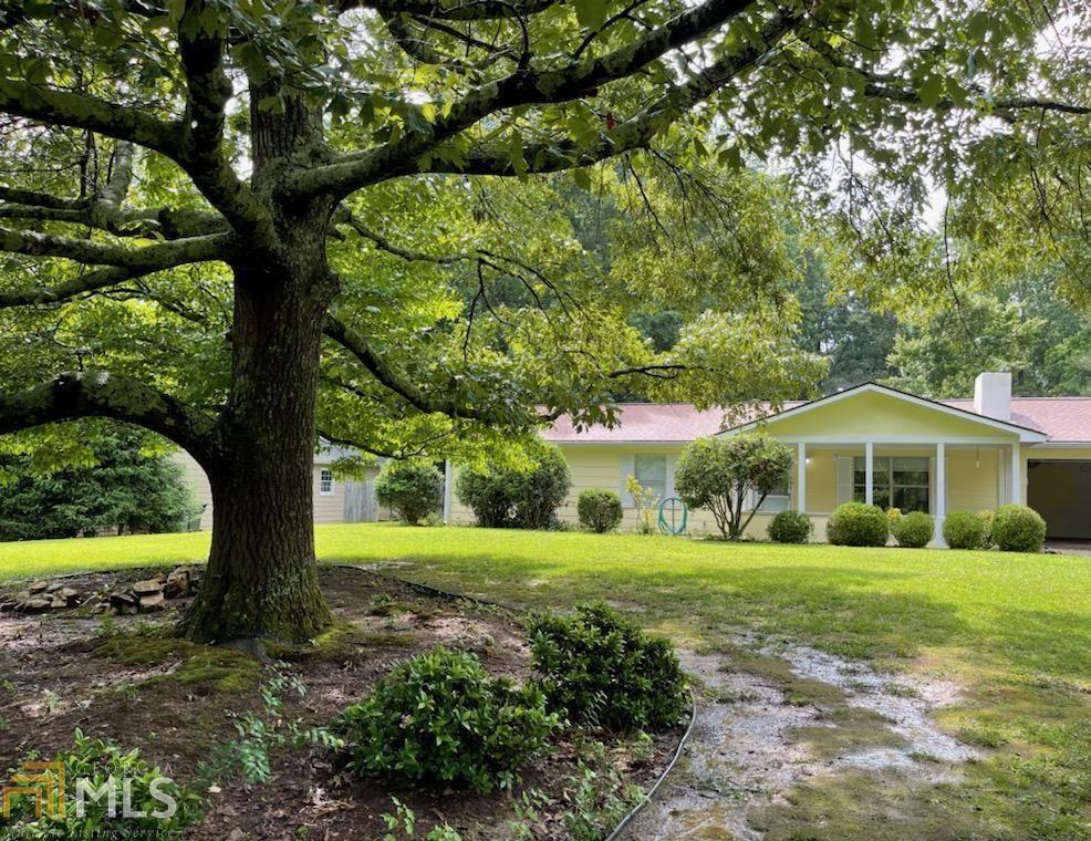 3013 Loring Road Kennesaw, GA 30152 - Photo 1 of 1 a view of a house with yard and large trees