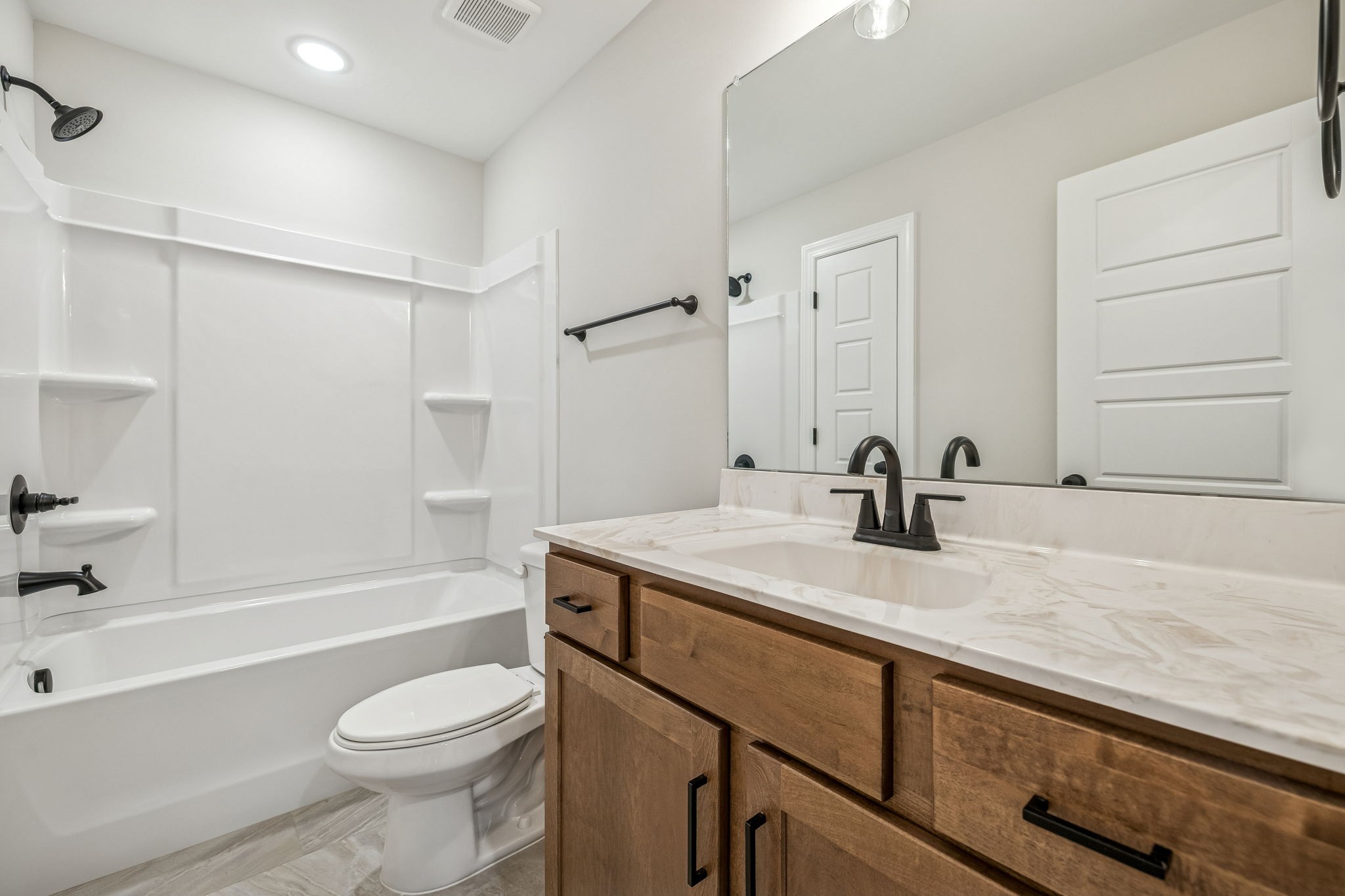 1057 Landing Lane Adams, TN 37010 - Photo 17 of 29 a bathroom with a granite countertop sink toilet and shower