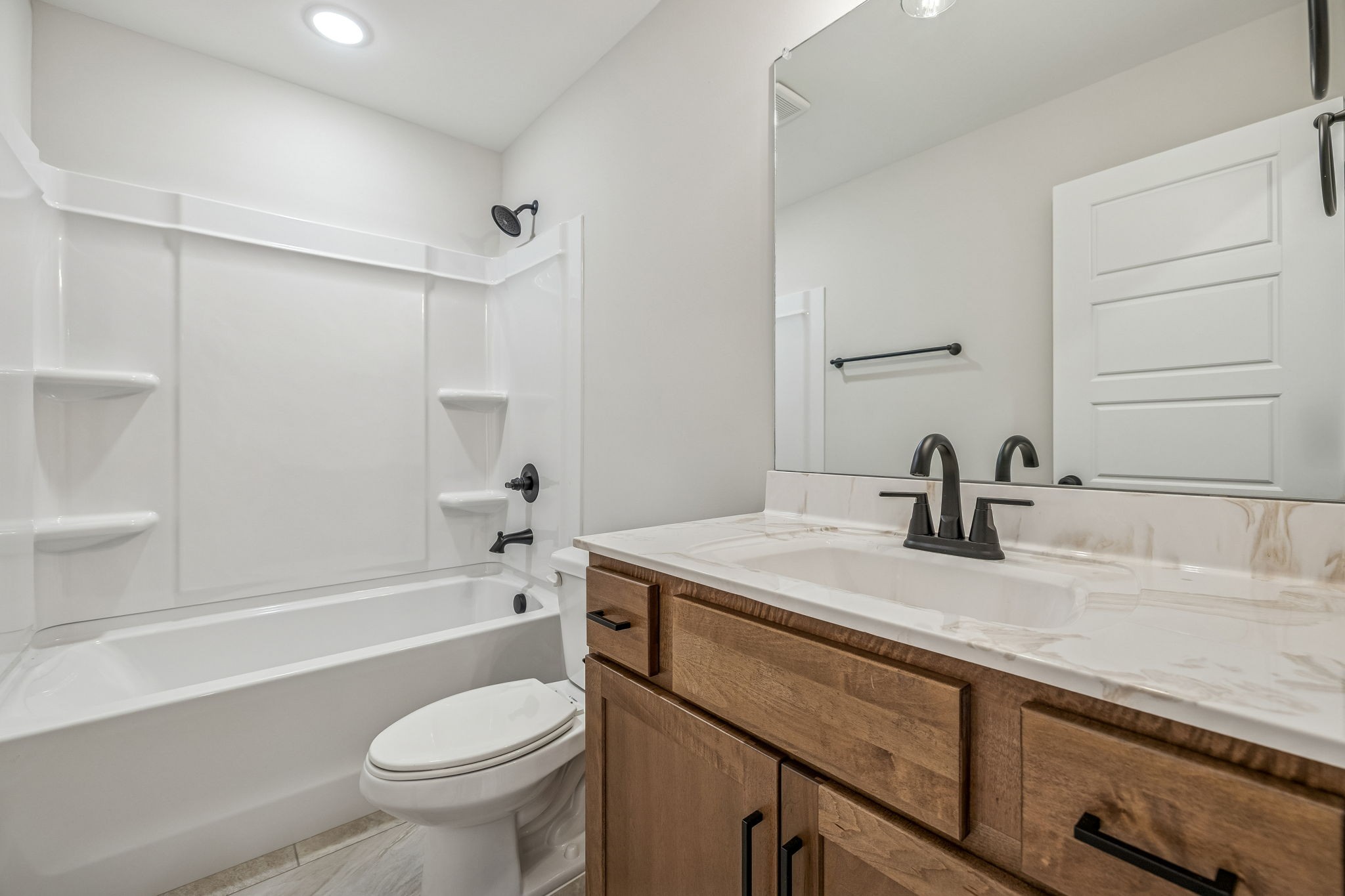 1057 Landing Lane Adams, TN 37010 - Photo 20 of 29 a bathroom with a sink a toilet and a bathtub