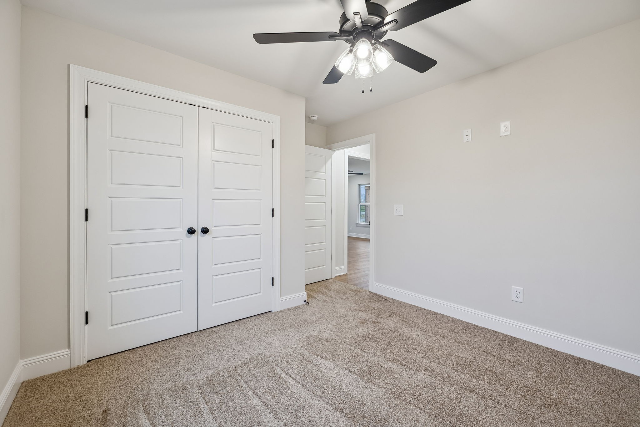 1057 Landing Lane Adams, TN 37010 - Photo 22 of 29 an empty room with closet and a chandelier fan
