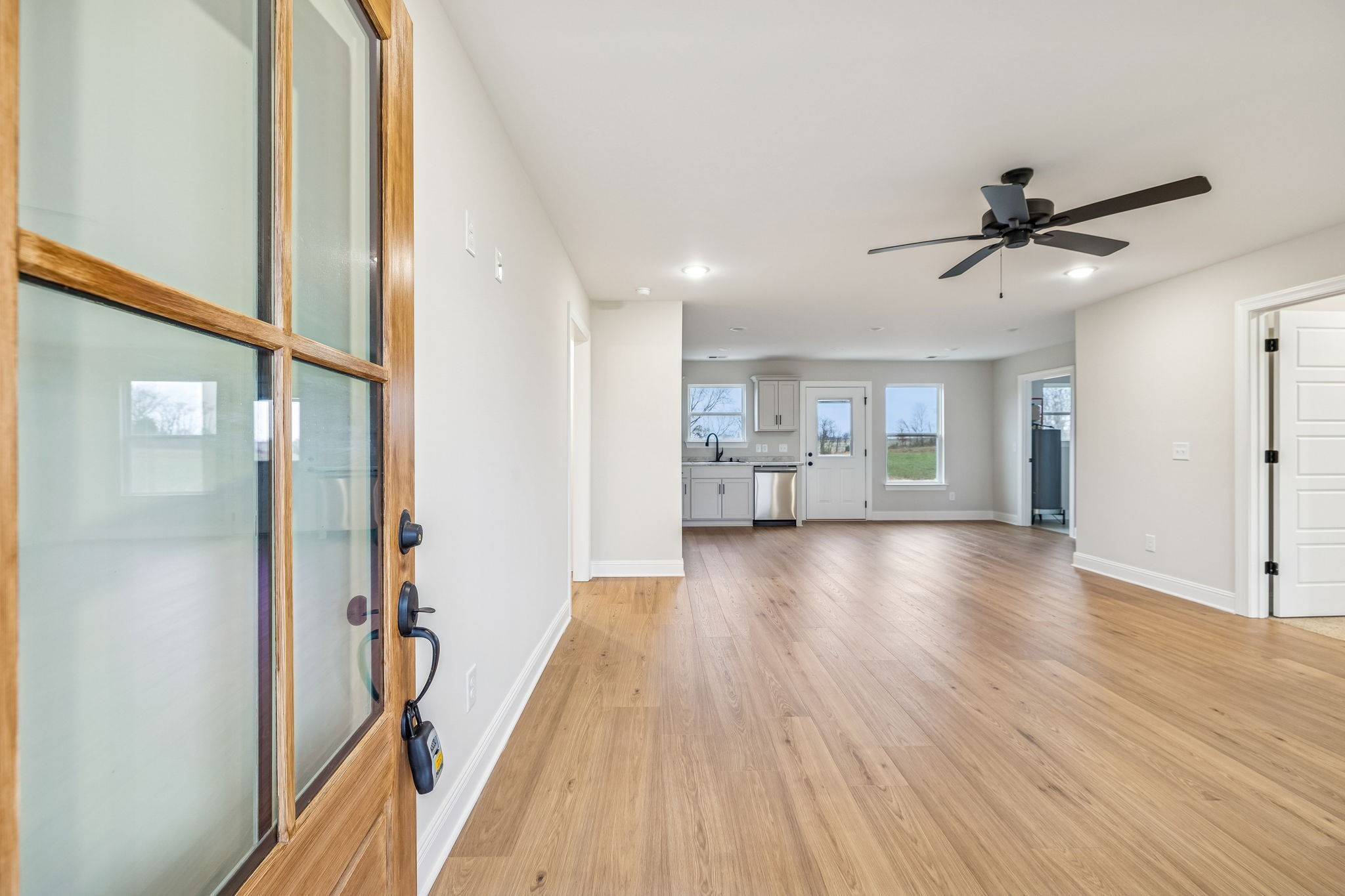 1057 Landing Lane Adams, TN 37010 - Photo 5 of 29 a view of a kitchen with a sink and refrigerator