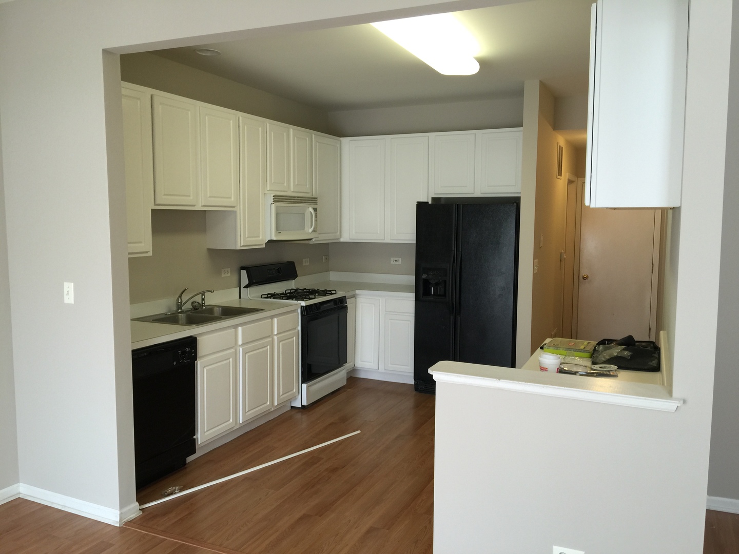 1499 Keystone Court, Unit 423 Elgin, IL 60120 - Photo 2 of 18 a kitchen with granite countertop a refrigerator and a stove top oven